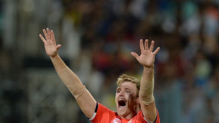 David Willey of England celebrates dismissing Lendl Simmons of the West Indies during the ICC World Twenty20 India 2016 Final
