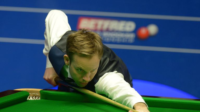 Ali Carter at the table against Stuart Bingham during day one of the Betfred Snooker World Championships