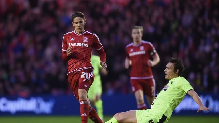 Gaston Ramirez of Middlesbrough battles with Huddersfield's Dean Whitehead