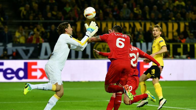 Dejan Lovren of Liverpool (6) and Roman Weidenfeller of Borussia Dortmund collide during the UEFA Europa League quarter final first leg match