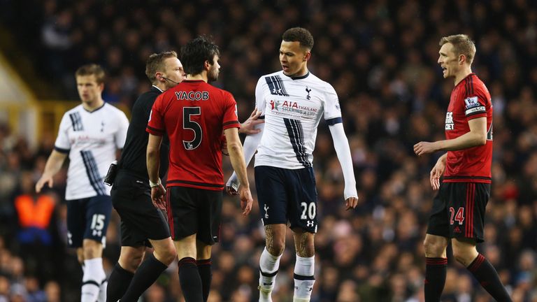 Dele Alli argues with Claudio Yacob as referee Mike Jones intervenes during the Premier League match between Tottenham and West Brom