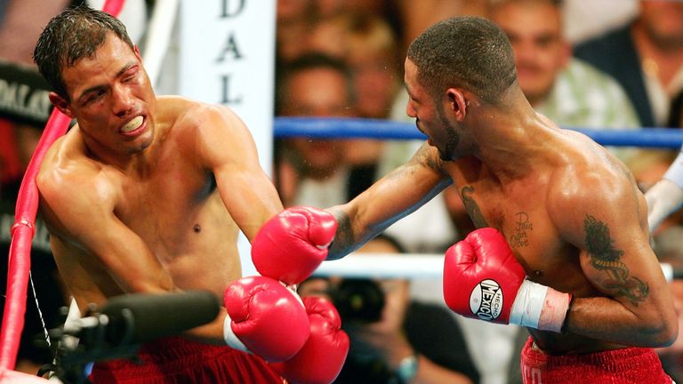 Diego Corrales lands a right on Jose Luis Castillo during their World Lightweight Unification bout on May 7, 2005