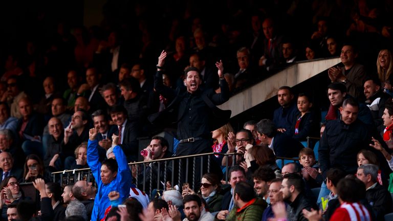 Diego Simeone watched much of Atletico Madrid's win over Malaga from the stand after he was sent off
