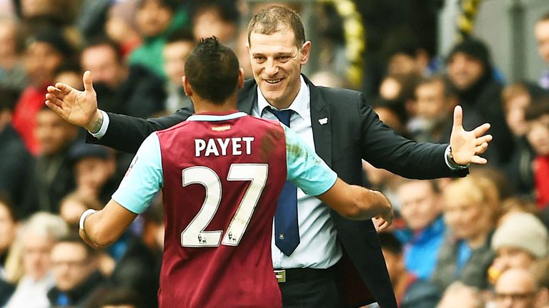Dimitri Payet celebrates with West Ham boss Slaven Bilic