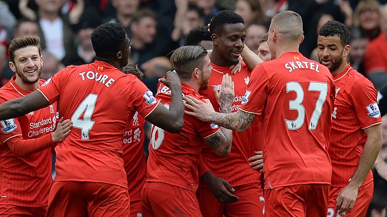 Liverpool's Belgian striker Divock Origi (4R) celebrates scoring his team's fourth goal