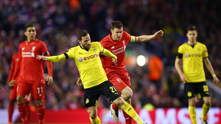 James Milner challenges Gonzalo Castro during Liverpool's match against Dortmund