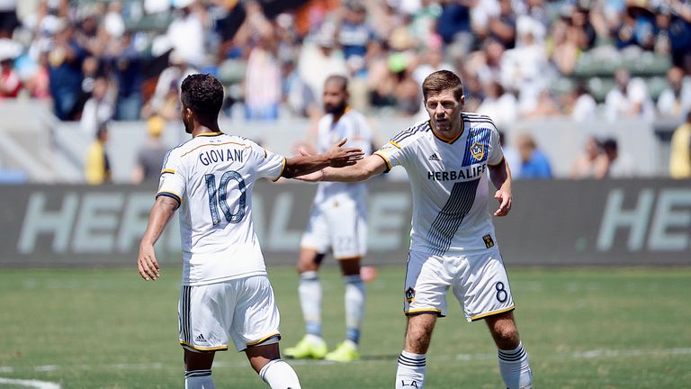 Steven Gerrard #8 of the Los Angeles Galaxy congratulates Giovani Dos Santos #10 as he walks off the pitch to be replaced against Sea