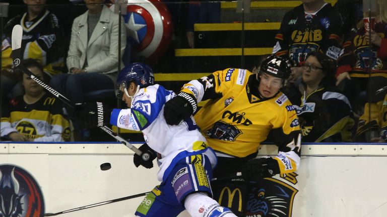 Coventry Blaze's Drew Fisher (left) and Nottingham Panthers' Geoff Waugh battle along the boards 