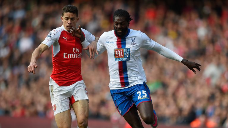 Emmanuel Adebayor of Crystal Palace is challenged by Gabriel Paulista of Arsenal 