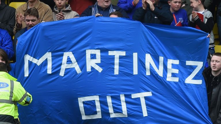 Everton supporters hold a banner against Roberto Martinez Manager of Everton 