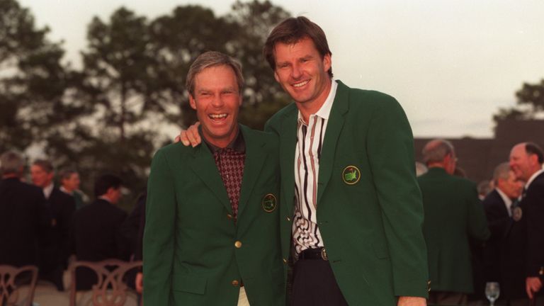 Nick Faldo of England is presented with his green jacket by 1995 Master Champion Ben Crenshaw of the USA after his victory in the 1996 Masters