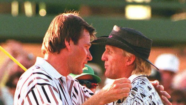 Masters Champion Nick Faldo of England is congratulated by runner-up Greg Norman of Australia on at the 18th green at Augusta