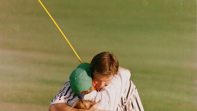 Nick Faldo of England is embraced by his caddie Fanny Sunesson on the 18th green after winning the 1996 Masters at Augusta National 