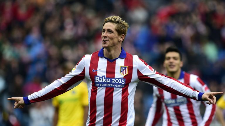 Atletico Madrid's forward Fernando Torres celebrates after scoring a goal during the Spanish league football match Club Atletico de Madrid vs Getafe