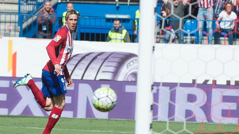 Atletico Madrid's forward Fernando Torres opens the scoring against Real Betis 