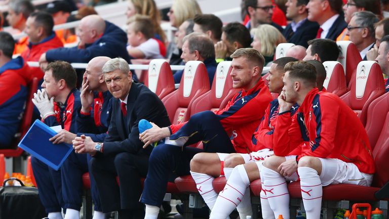 Arsene Wenger (3rd left) looks on during the Premier League match between Arsenal and Watford