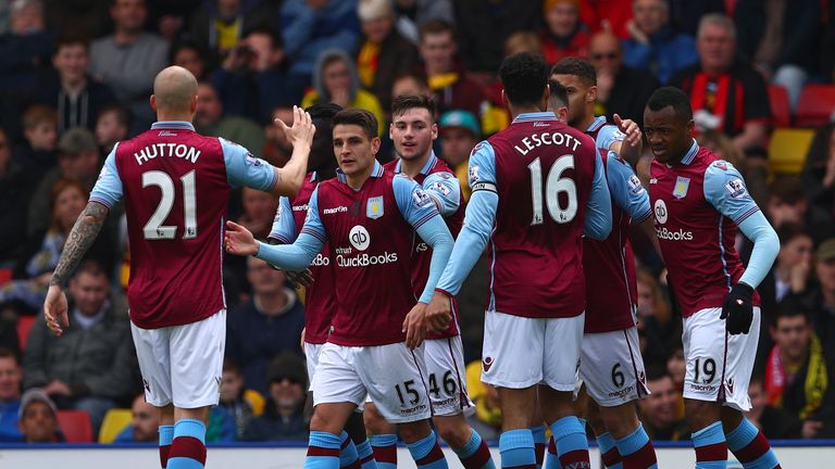 Aston Villa players celebrate their first goal by Ciaran Clark (3rd R, obscured)