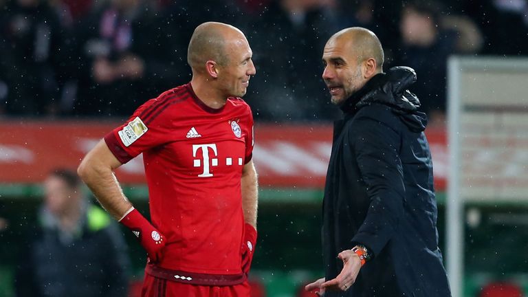 Pep Guardiola celebrates with Bayern Munich boss Arjen Robben