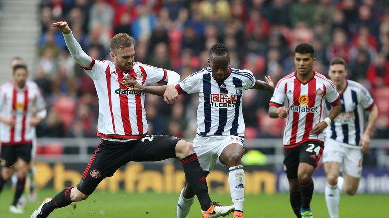 Saido Berahino of West Brom is tackled by Jan Kirchhoff of Sunderland
