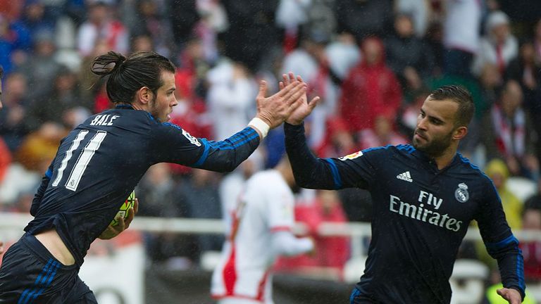 Real Madrid forward Gareth Bale (L) celebrates after scoring with Real Madrid's forward Jese Rodriguez