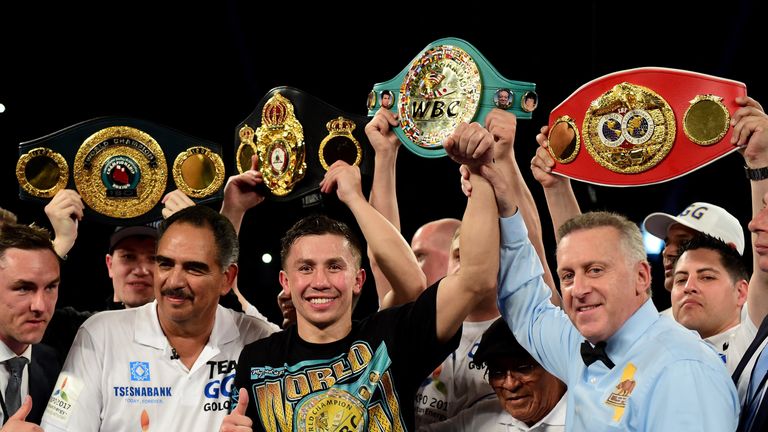 Gennady Golovkin poses with his belts after his second-round TKO of Dominic Wade in Los Angeles