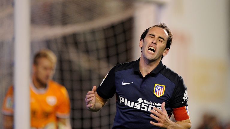 Atletico Madrid will be without Diego Godin for the visit of Malaga.