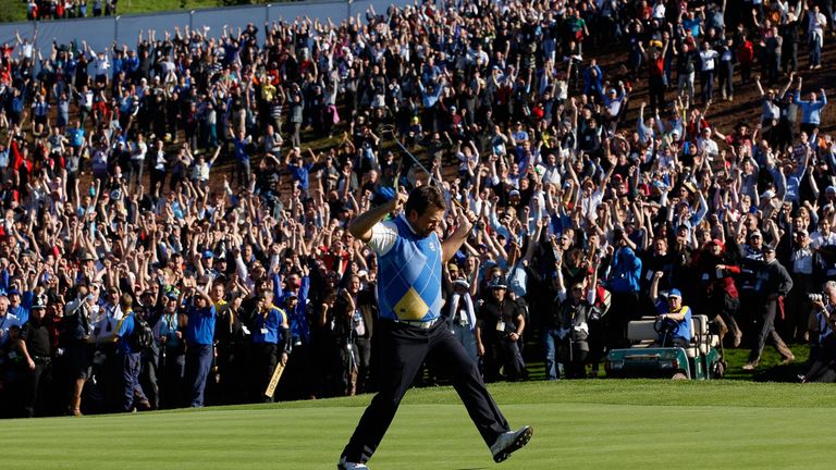 Graeme McDowell of Europe celebrates his birdie putt on the 16th green in the singles matches during the 2010 Ryder Cup at th