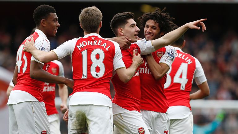 Hector Bellerin celebrates with teammates after scoring Arsenal's 3rd goal against Watford 