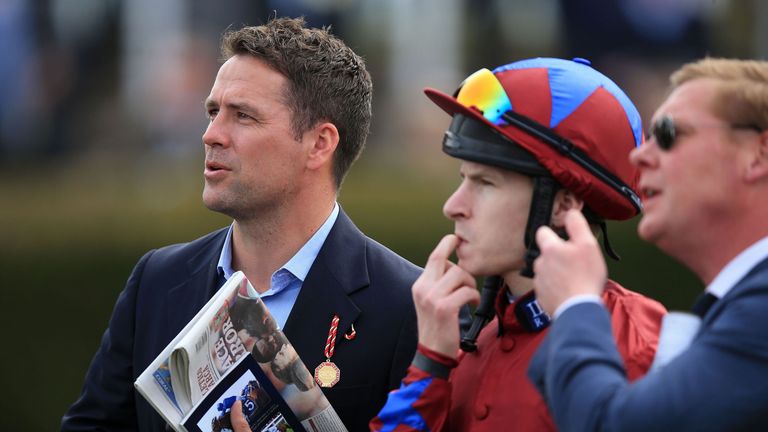 Former footballer Michael Owen (left) in the paddock before the second race