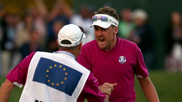  Ian Poulter of Europe celebrates with his caddie Terry Mundy after making birdie on the 16th green during day two of the After