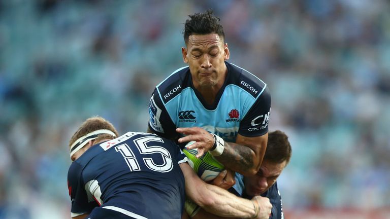 Israel Folau of the Waratahs is tackled 
