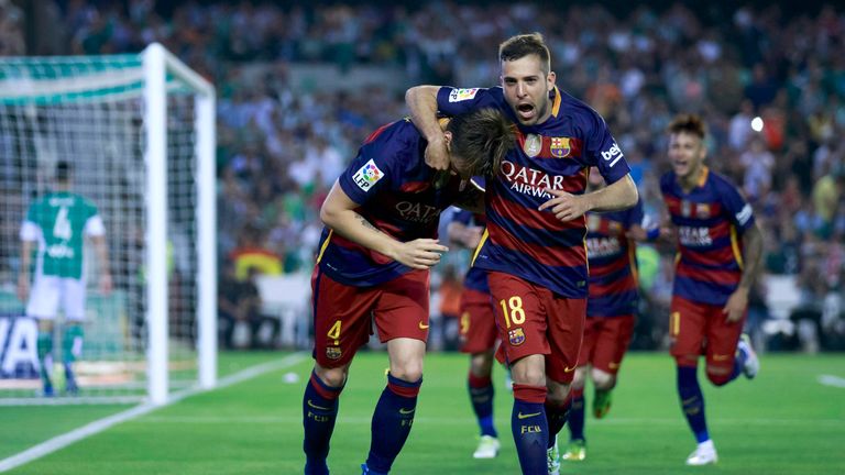 Ivan Rakitic (L) of Barcelona celebrates scoring their opening goal