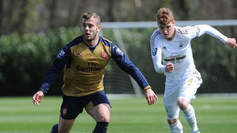 Jack Wilshere of Arsenal takes on Jay Futon of Swansea during an U21s match on April 14, 2016 in Swansea, Wales. 