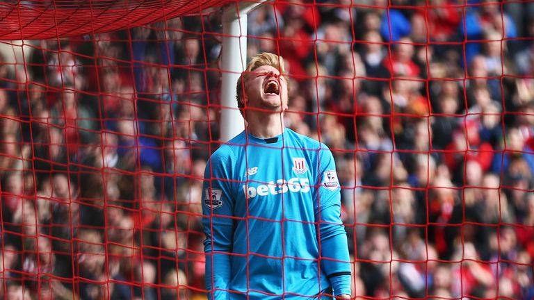 Goalkeeper Jakob Haugaard of Stoke City reacts as Daniel Sturridge of Liverpool scores their second goal in the hosts' 4-1 win