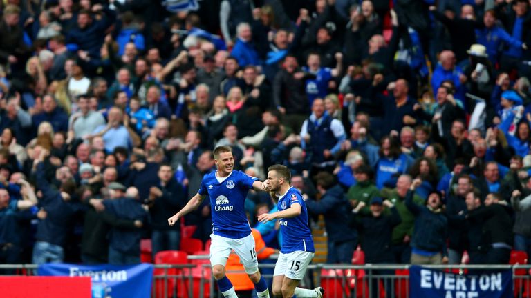 James McCarthy and Tom Cleverley celebrate in front of the Everton fans after Chris Smalling's own goal at Wembley