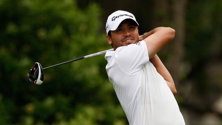 Jason Day shared the lead until being forced to take a penalty drop at the last