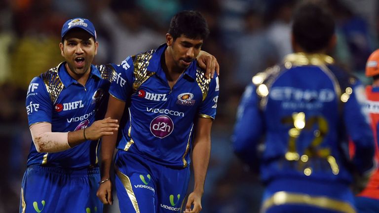 Mumbai Indians captain Rohit Sharma (L) and Jasprit Bumrah (R) celebrate the wicket of Dwayne Bravo during the 2016 Indian Premier League (IPL)