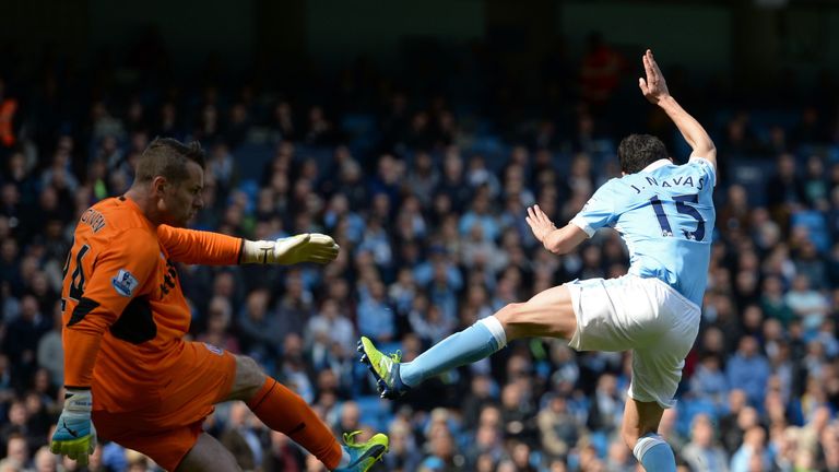 Manchester City's Jesus Navas attempts to challenge Stoke goalkeeper Shay Given