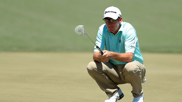 Jim Herman of the United States lines up a putt on the fourth green during the final round of the Shell Houston Open