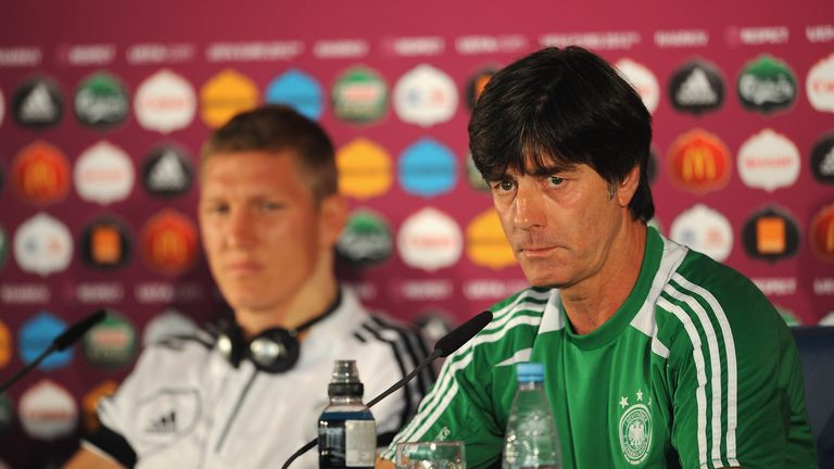 KHARKOV, UKRAINE - JUNE 12:  In this handout image provided by UEFA, (L-R) Bastien Schweinsteiger and coach Joachim Low of Germany during a UEFA EURO 2012 