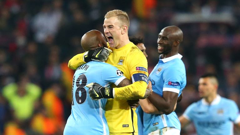 Joe Hart (L) and Fabian Delph celebrate after Manchester City reaching the Champions League semi-finals 