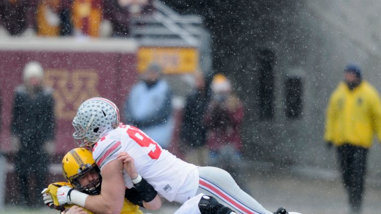 Joey Bosa #97 of the Ohio State Buckeyes sacks Mitch Leidner #7 of the Minnesota Golden Gophers during the first quarter of 