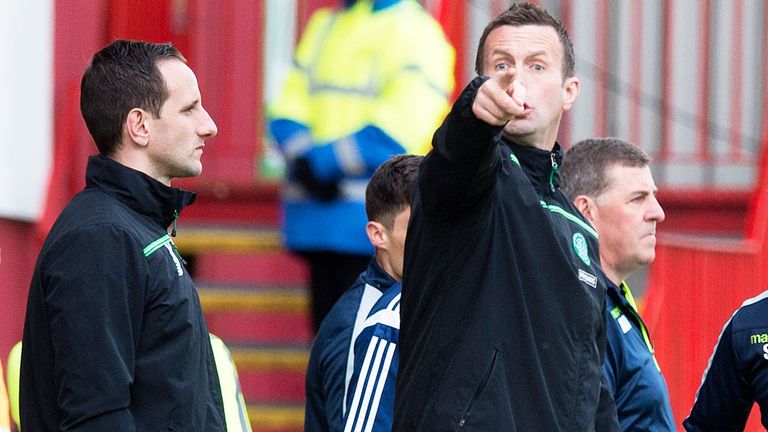 Celtic assistant John Kennedy (l) and Motherwell boss Mark McGhee (r) either side of Ronny Deila