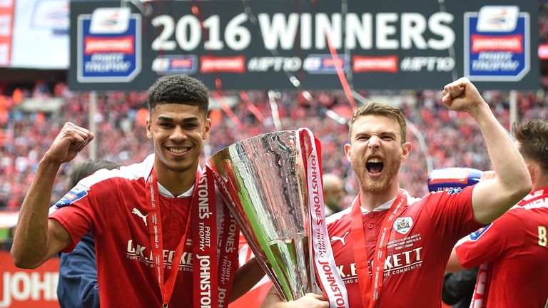 LONDON, ENGLAND - APRIL 03:  (L-R) Ashley Fletcher and Sam Winnall of Barnsley celebrate with the trophy during the Johnstone's Paint Trophy Final match be