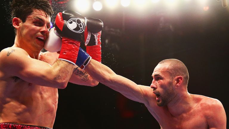 Jose Pedraza lands a right hand on Stephen Smith