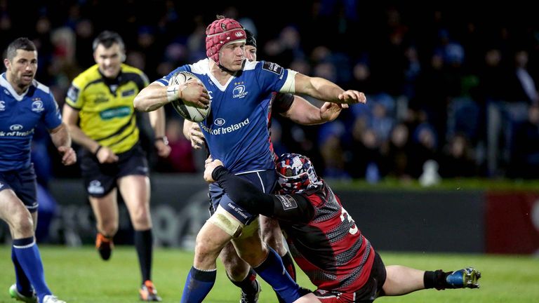 Leinster's Josh van der Flier is tackled by  WP Nel of Edinburgh.