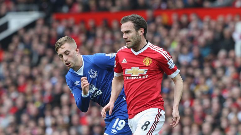 Juan Mata of Manchester United in action with Gerard Deulofeu of Everton