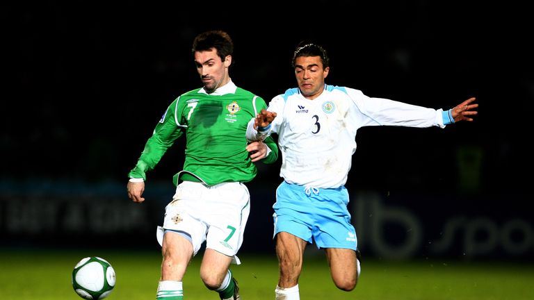  Keith Gillespie of Northern Ireland is tackled by Mauro Marani of San Marino during the FIFA 2010 Group Three World 