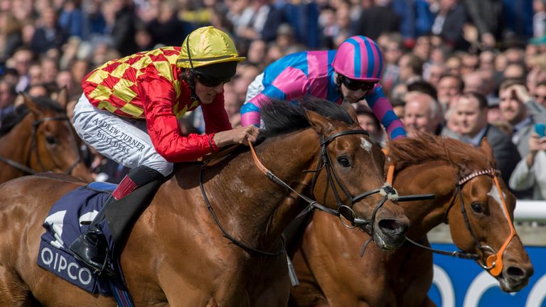 Knight Owl ridden by George Wood (left) gets the better of Examiner ridden by Oisin Murphy