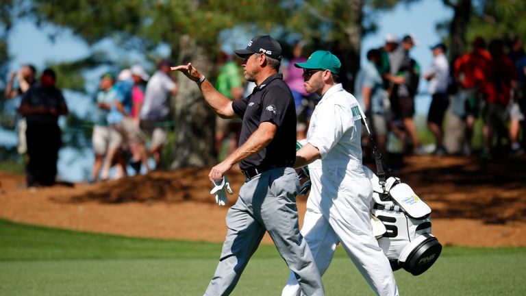 Lee Westwood of England walks down the fairway during a practice round prior to the start of the 2016 Masters Tournament at Augusta National Golf Club 